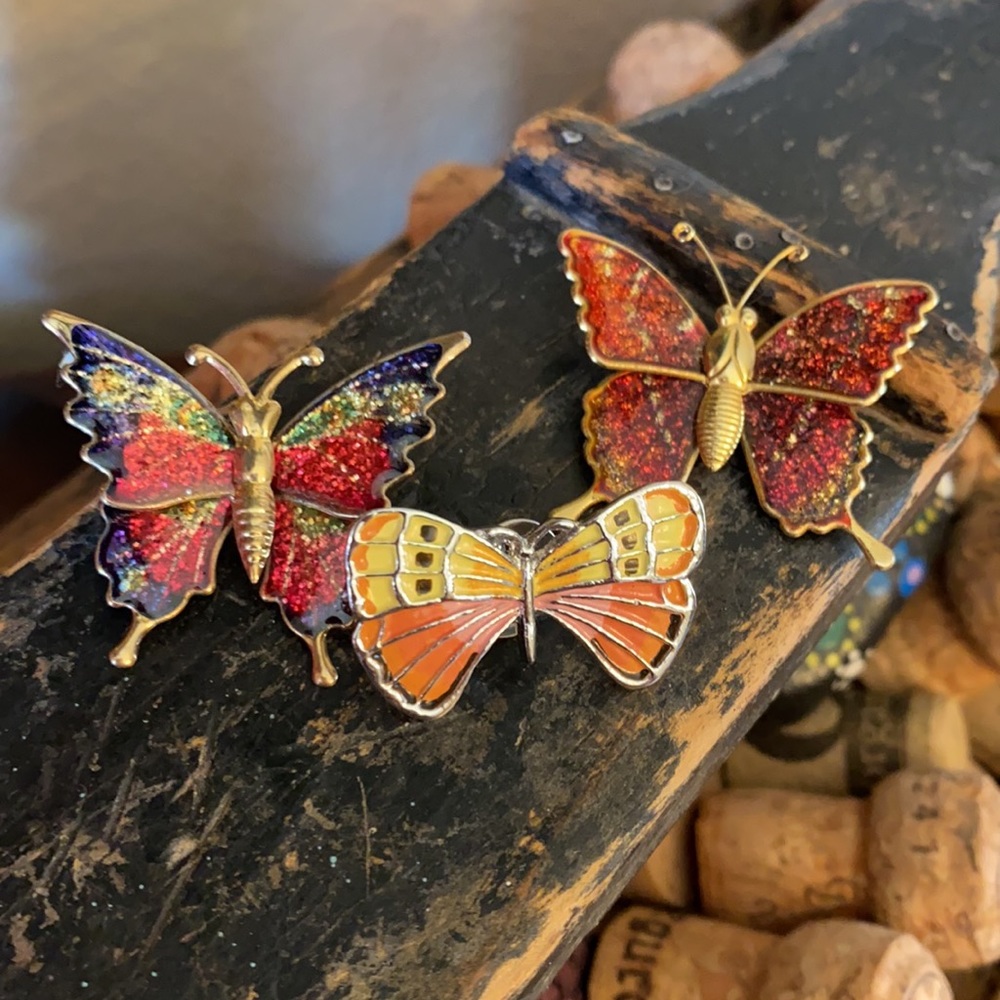 3 Butterfly brooches one includes a little card.
